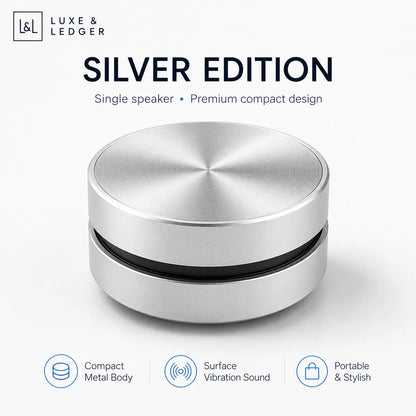 Silver speaker with Luxe & Ledger branding on a white background