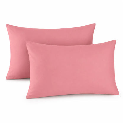 Two pink pillowcases on a white background