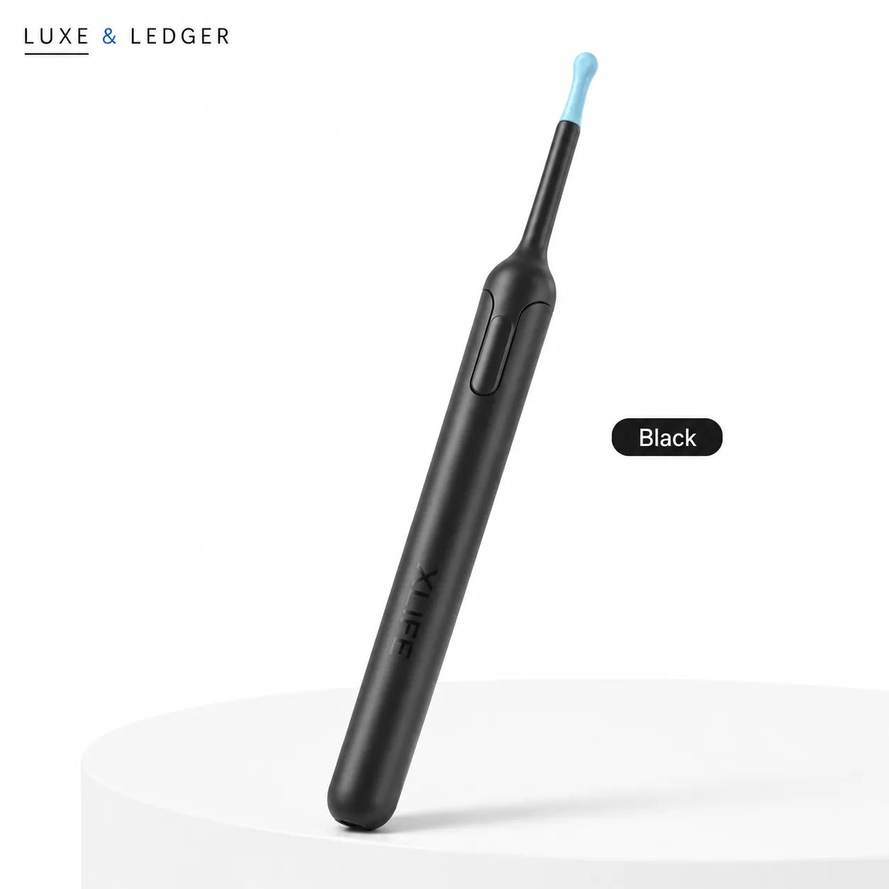 Black dental tool with blue tip on a white background, branded 'LUXE & LEDGER'.