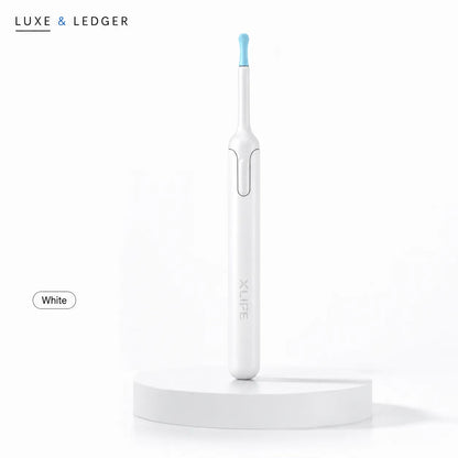 White electric toothbrush with blue accent on a white background, branded 'LUXE & LEDGER'.