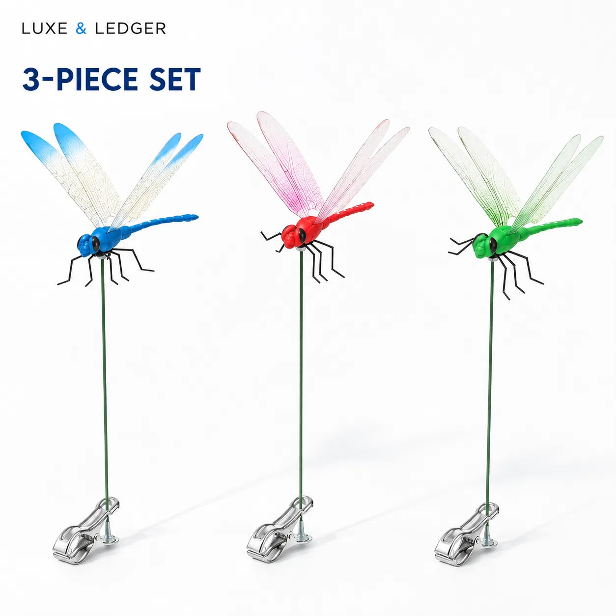Three colorful dragonfly-shaped clips on stands with 'Luxe & Ledger' branding.