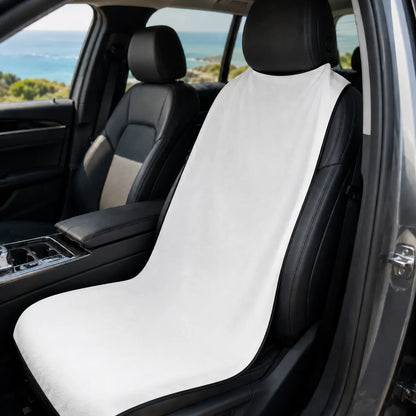 Car seat with a white cover in a vehicle with a scenic background