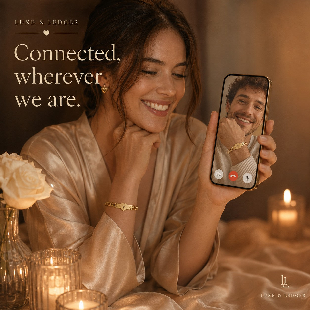 Woman in a satin robe smiling at a phone call with a man, surrounded by candles and flowers.