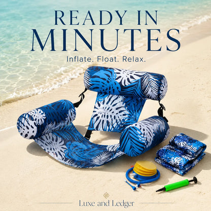 Blue inflatable lounge chair with accessories on a sandy beach