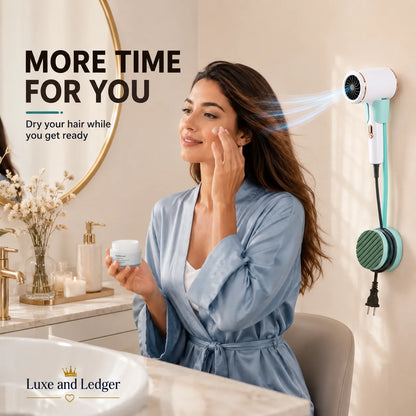 Woman in a bathroom using a hair dryer to dry her hair while applying cream, with 'Luxe and Ledger' branding.
