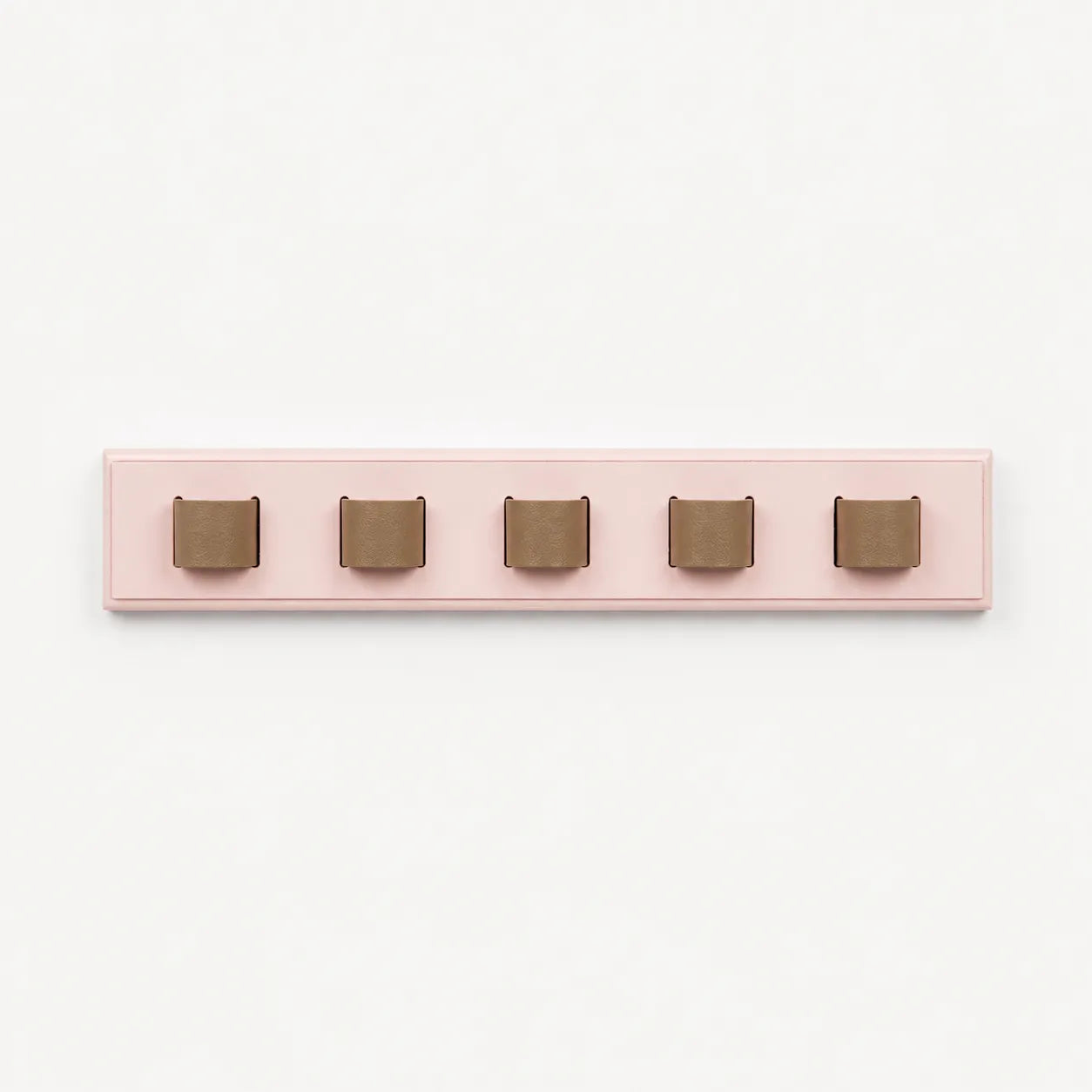 Pink wall hook with five brown hooks on a white background
