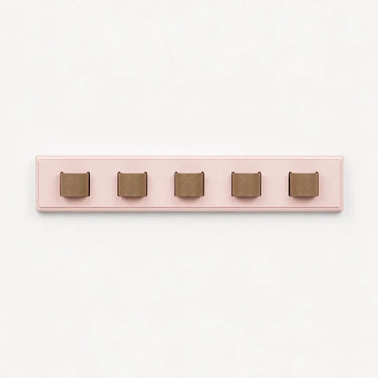 Pink wall hook with five brown hooks on a white background