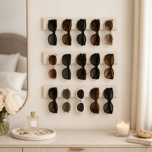 Wall-mounted display of sunglasses in a bedroom setting