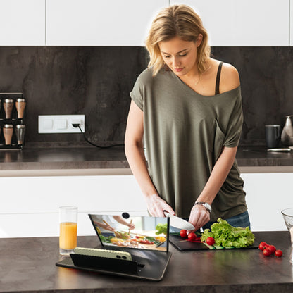 Woman preparing food in a kitchen with a  phone screen magnifier 