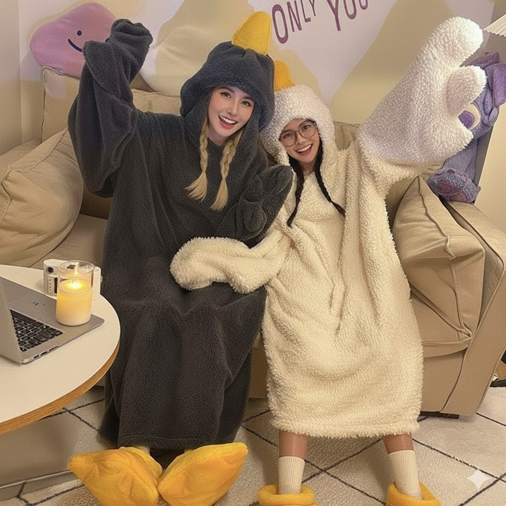 Two people wearing animal-themed onesies in a casual indoor setting.