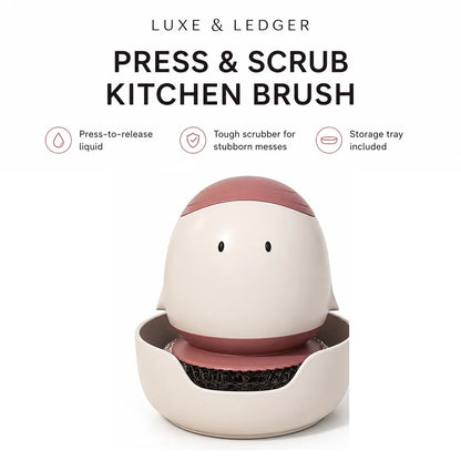LUXE & LEDGER Press & Scrub Kitchen Brush in a cream and dusty rose color, shown with its storage tray on a white background with feature icons and text.