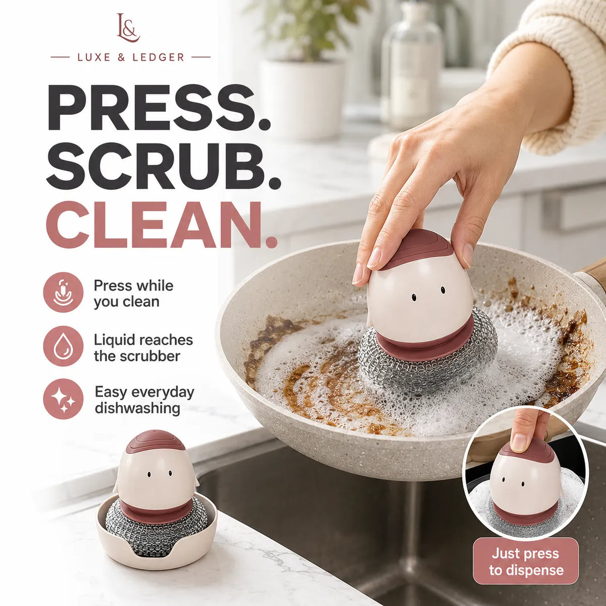 A kitchen scene showing a hand pressing a small ceramic dishwashing scrubber into soapy water inside a pan. The scrubber has a cream body, dark brown top, and gray scrubbing bristle base.