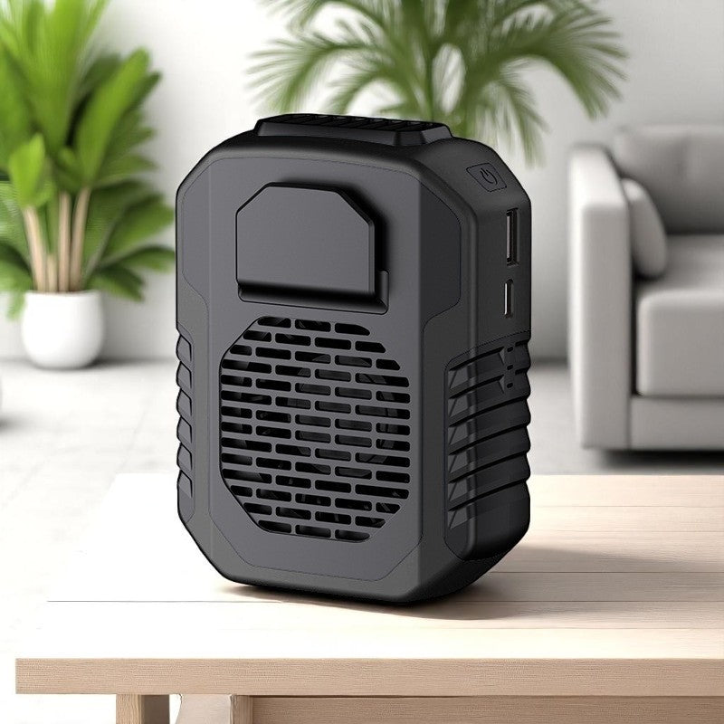Black portable air conditioner on a wooden table with a blurred indoor background