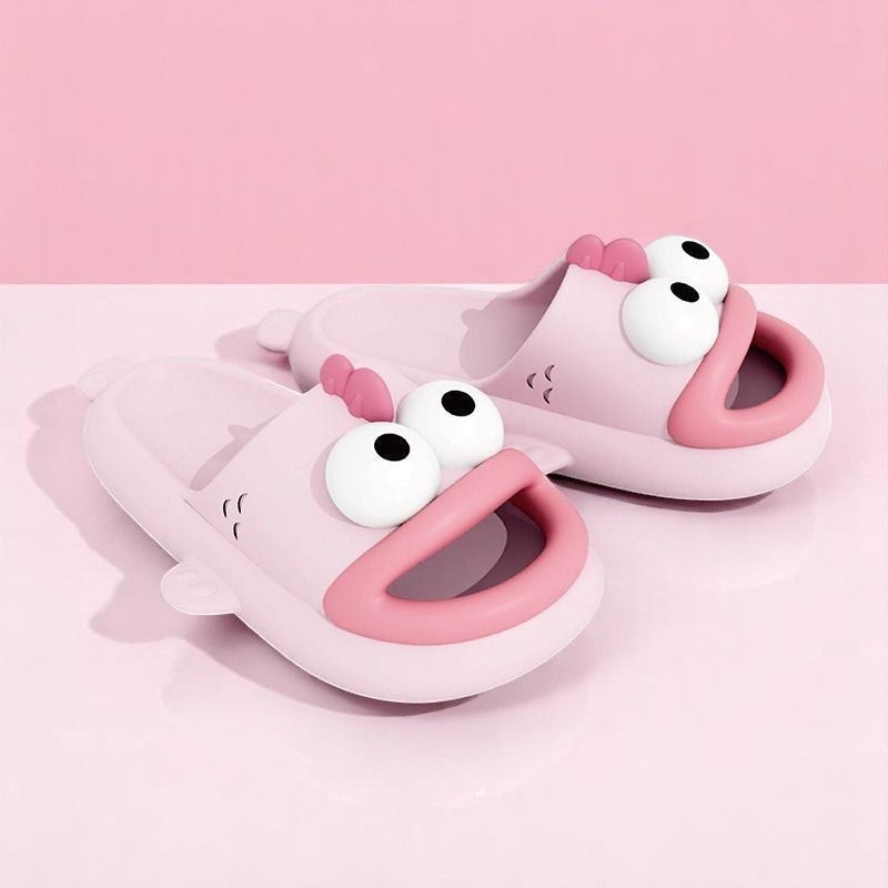 A pair of blue EVA slippers designed to resemble a cartoon character, with large eyes and a happy expression.
