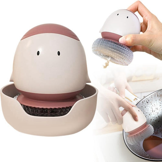 Cleaning tool with a scrubber held by a hand, showing its use on a dish.