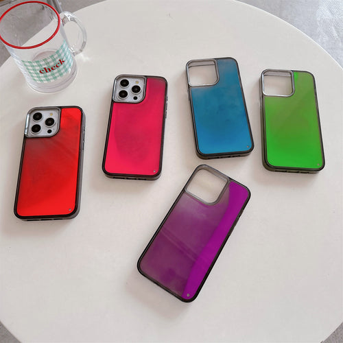 A selection of phone cases with a glowing quicksand design in various colors including red, blue, purple, and green, displayed on a white surface.