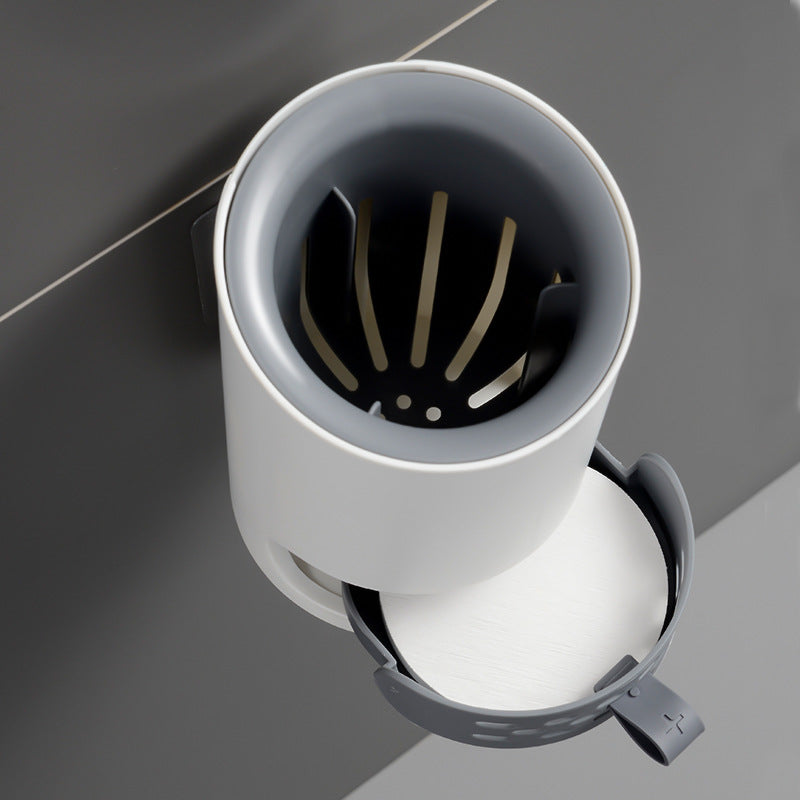 White sink drain cover with a black interior on a gray background
