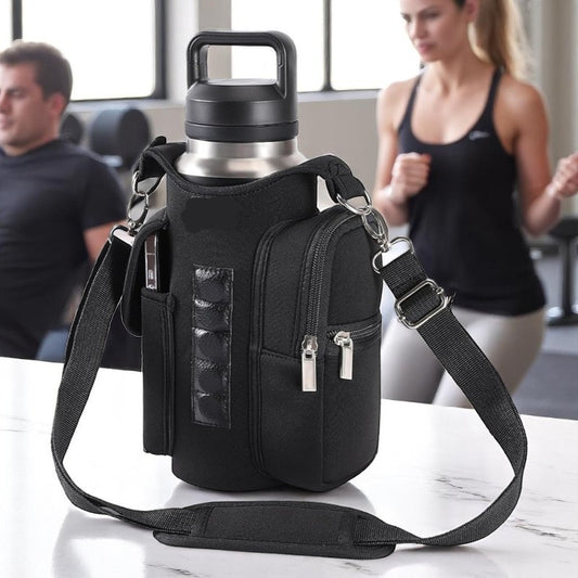 Black crossbody bag with water bottle holder on a marble surface, with people in the background.