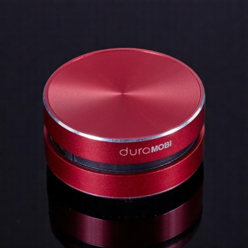 A compact and sleek black mini bone conduction speaker with the brand name 'DURAMOBI' visible on the top surface.