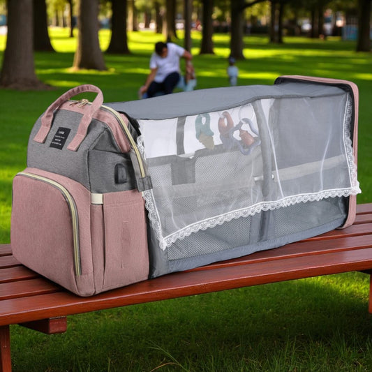 Baby carrier with mesh side on a park bench