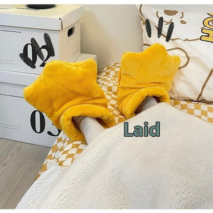 Yellow slippers on a checkered blanket with 'Laid' text