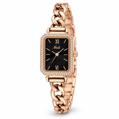 A women's rectangular analog watch with a rose gold-tone metal case and link bracelet, featuring a black dial with gold-tone hands and Roman numeral hour markers, and a bezel accented with small clear crystals.