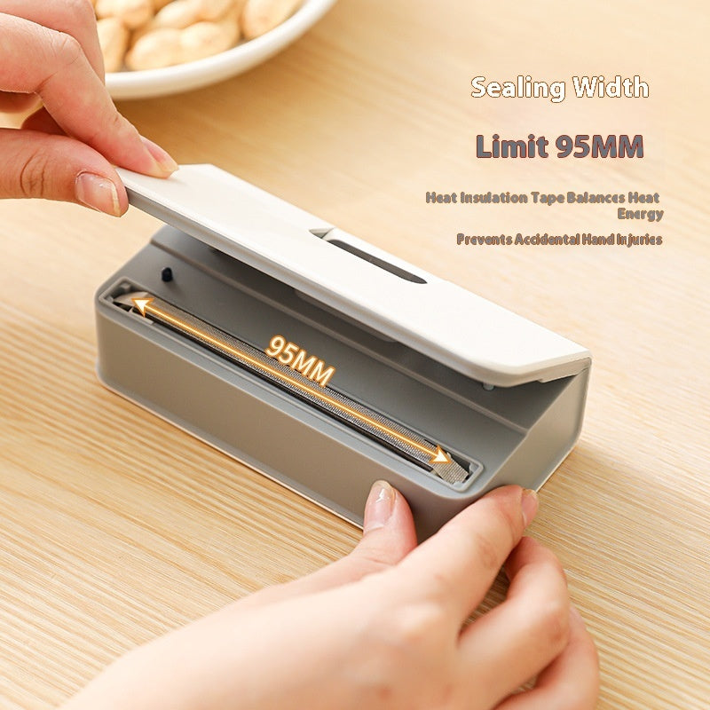 Handheld sealing device with 95MM width limit on a wooden surface