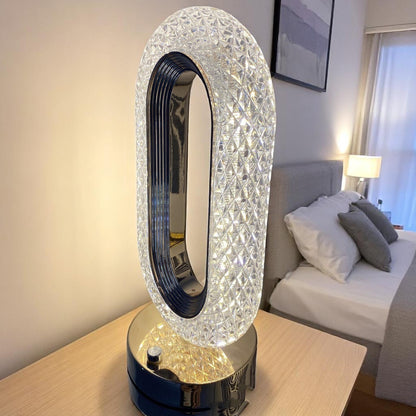 Decorative lamp with crystal design on a table in a bedroom setting