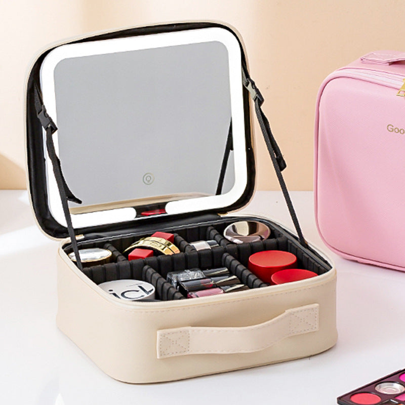 Makeup case with mirror and cosmetics on a light background