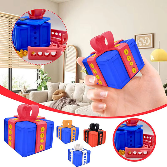 Colorful gift-shaped toys with a hand holding one, set against a living room background.