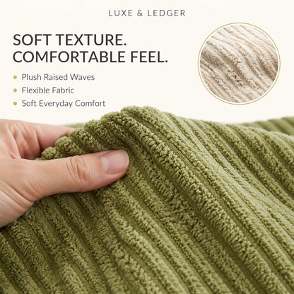 Close-up of a hand stretching a ribbed knit fabric to show its soft texture and flexibility, with text reading 'SOFT TEXTURE. COMFORTABLE FEEL.