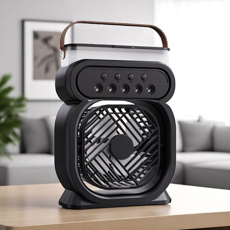 Black portable fan with a handle on a wooden surface in a living room setting