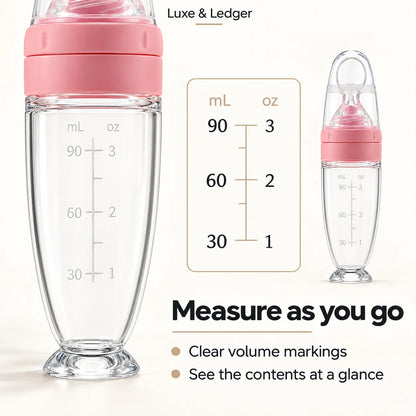 Clear baby bottle with a pink lid and printed volume markings in mL and oz, shown on a light beige background with a measurement reference chart and text reading 'Luxe & Ledger' and 'Measure as you go'.