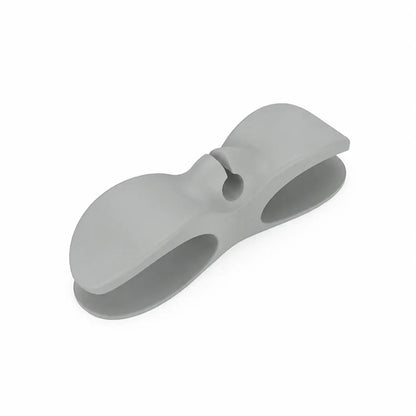 A light gray silicone baby bottle clip or carrier accessory, shown on a clean white background.