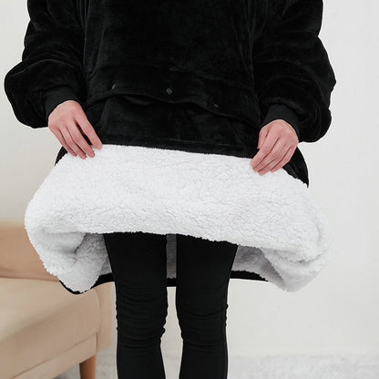 Person holding a white textured blanket against a neutral background