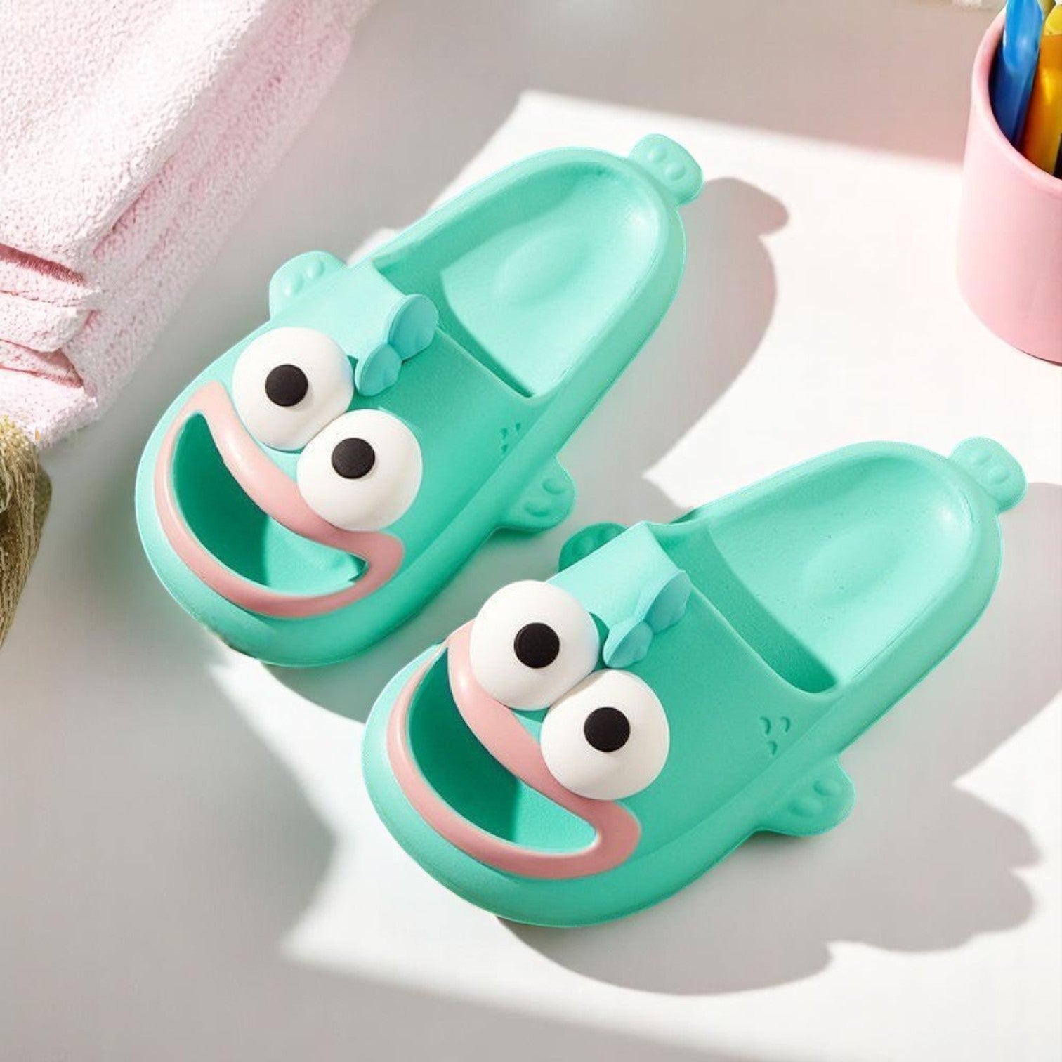 A pair of blue EVA slippers designed to resemble a cartoon character, with large eyes and a happy expression.