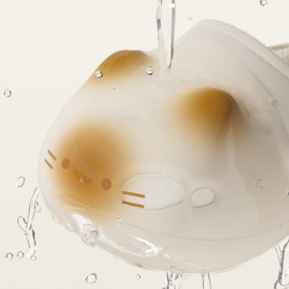 Cute cartoon character with a brown face and white body, surrounded by water droplets on a light gray background.