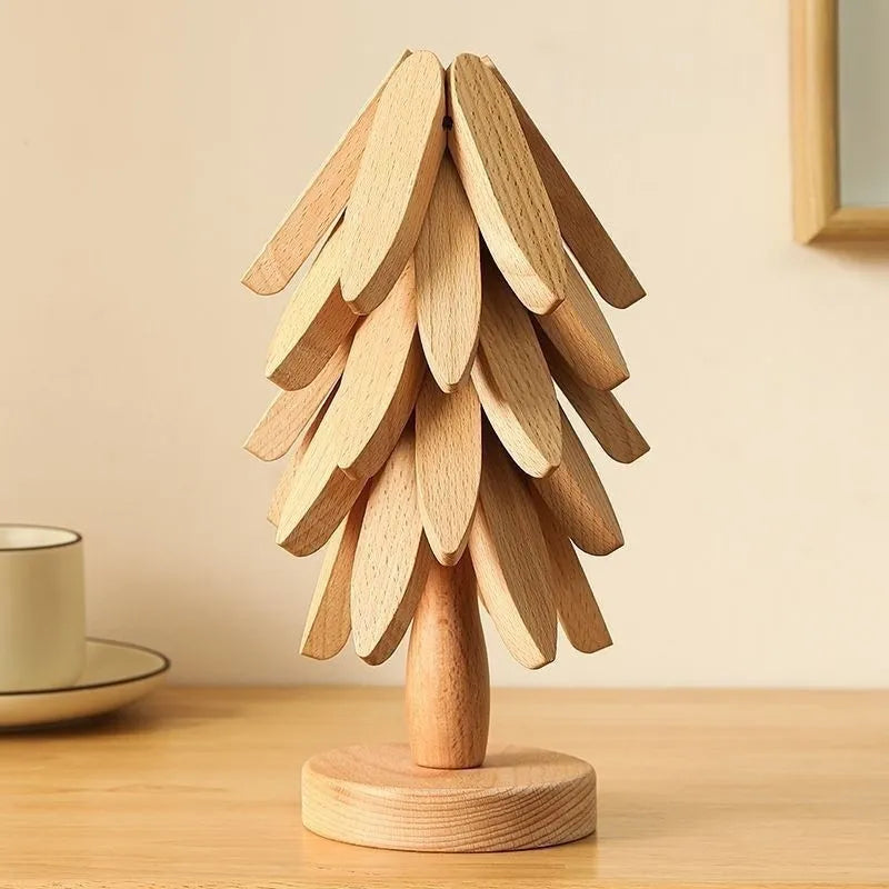 Wooden tree-shaped lamp on a wooden surface with a neutral background