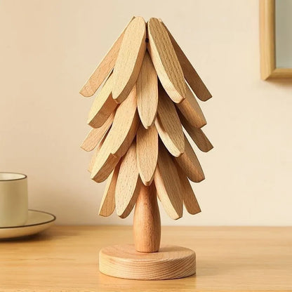 Wooden tree-shaped lamp on a wooden surface with a neutral background
