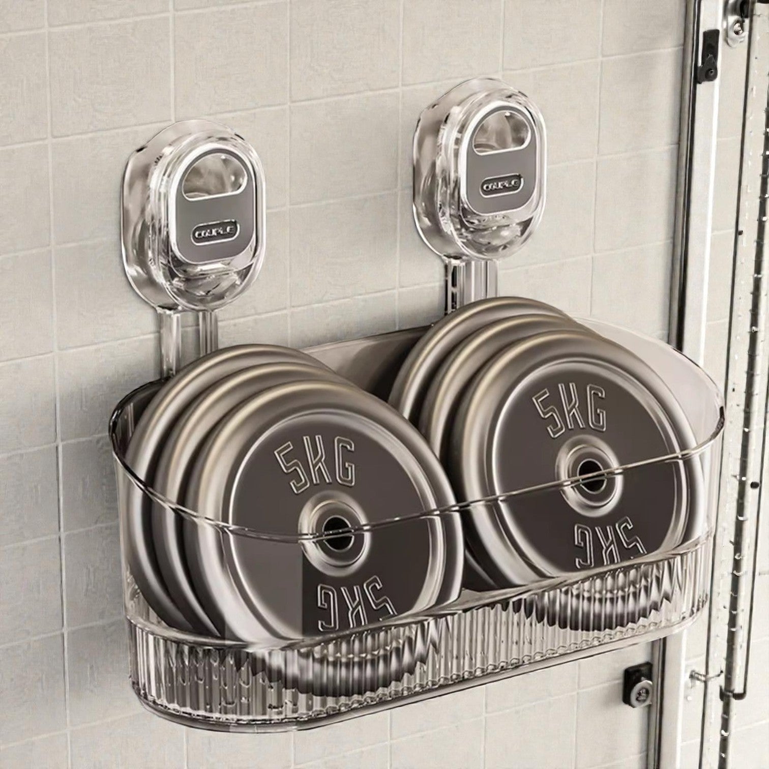 Set of weight plates in a holder on a tiled wall