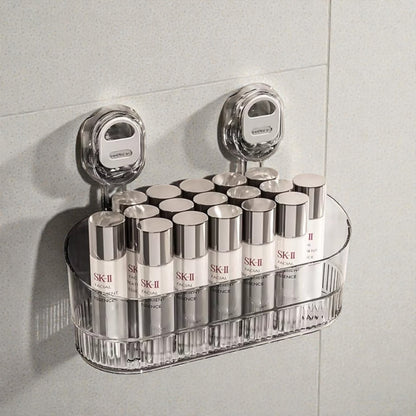 Clear plastic shelf holding multiple SK-II skincare products against a tiled wall.