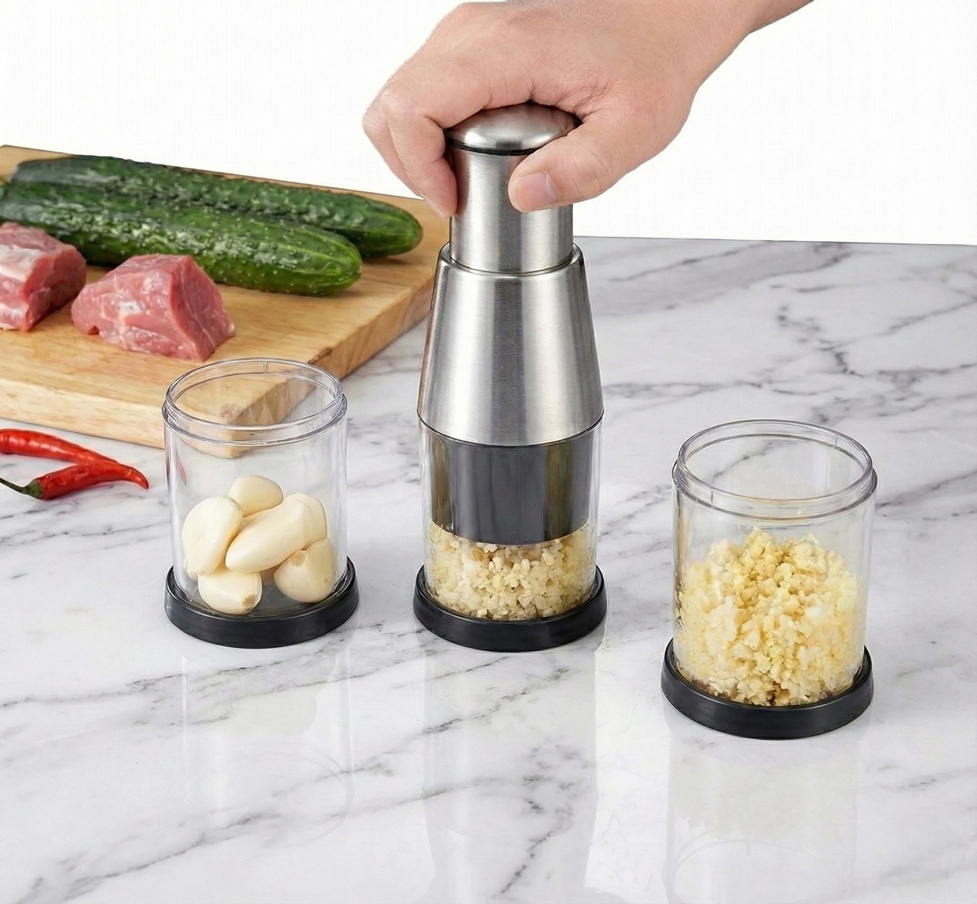Hand using a pepper grinder with jars of ingredients on a marble surface