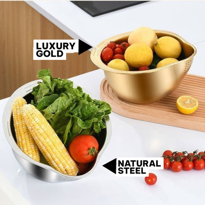 Two bowls, one gold and one silver, filled with fruits and vegetables on a kitchen counter.