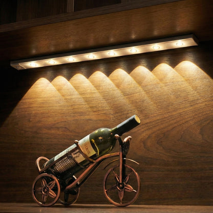 Wine bottle on a decorative bike stand with warm lighting