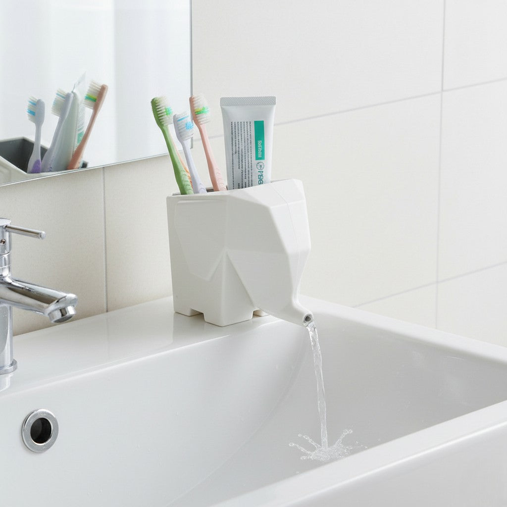 White elephant-shaped toothbrush holder on a bathroom sink with toothbrushes and toothpaste.