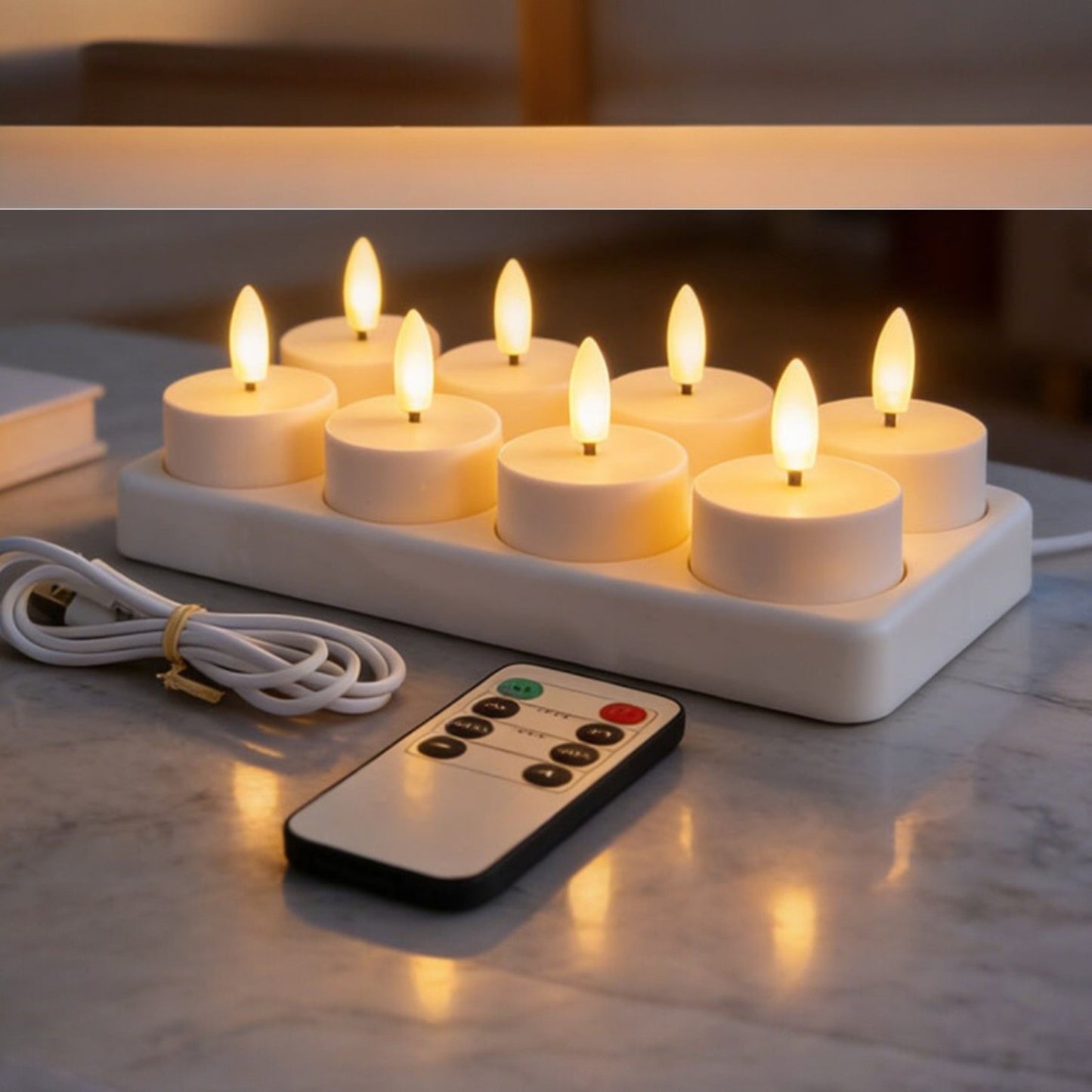 Set of electric candles with a remote control on a marble surface