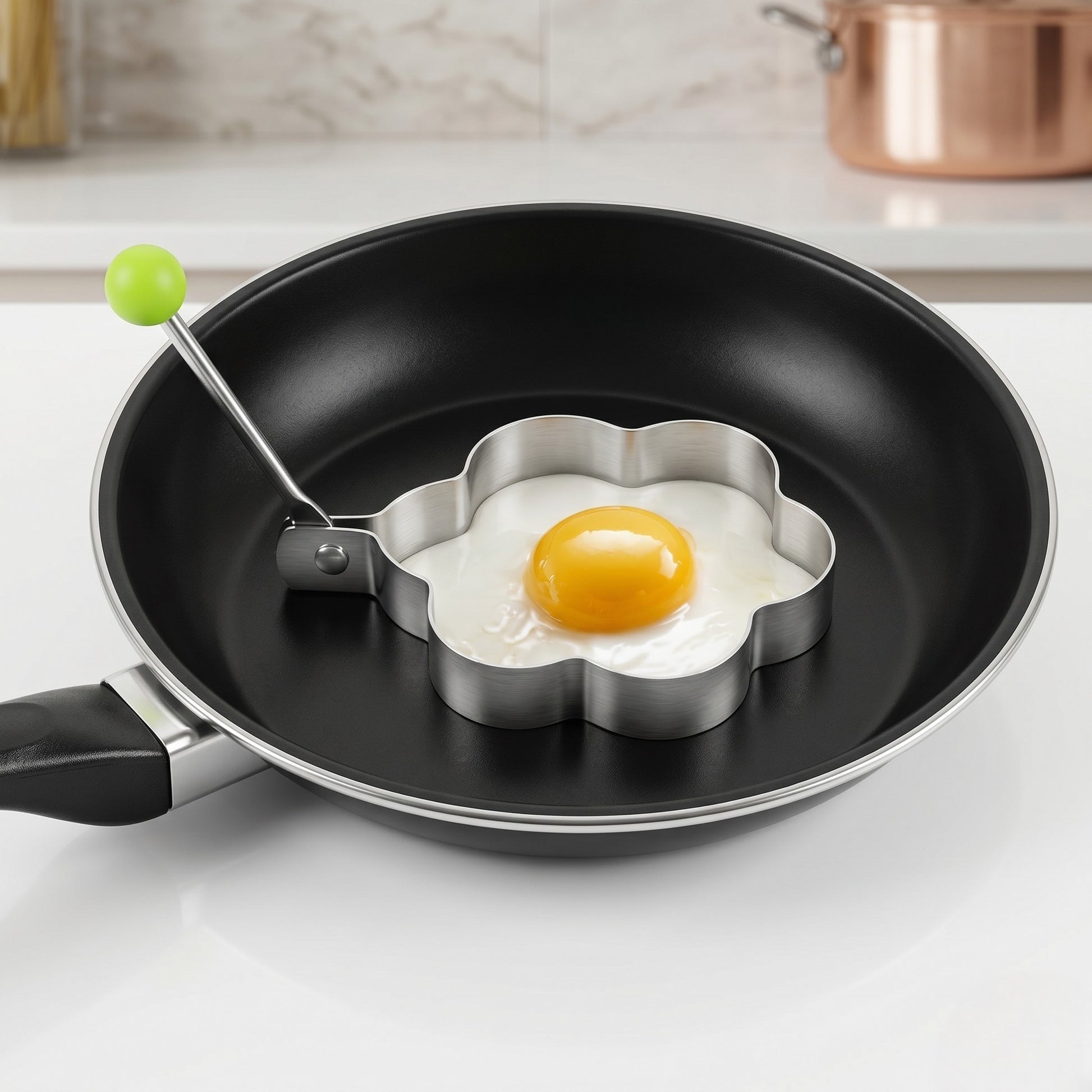 Flower-shaped egg mold in a frying pan with an egg being cooked.