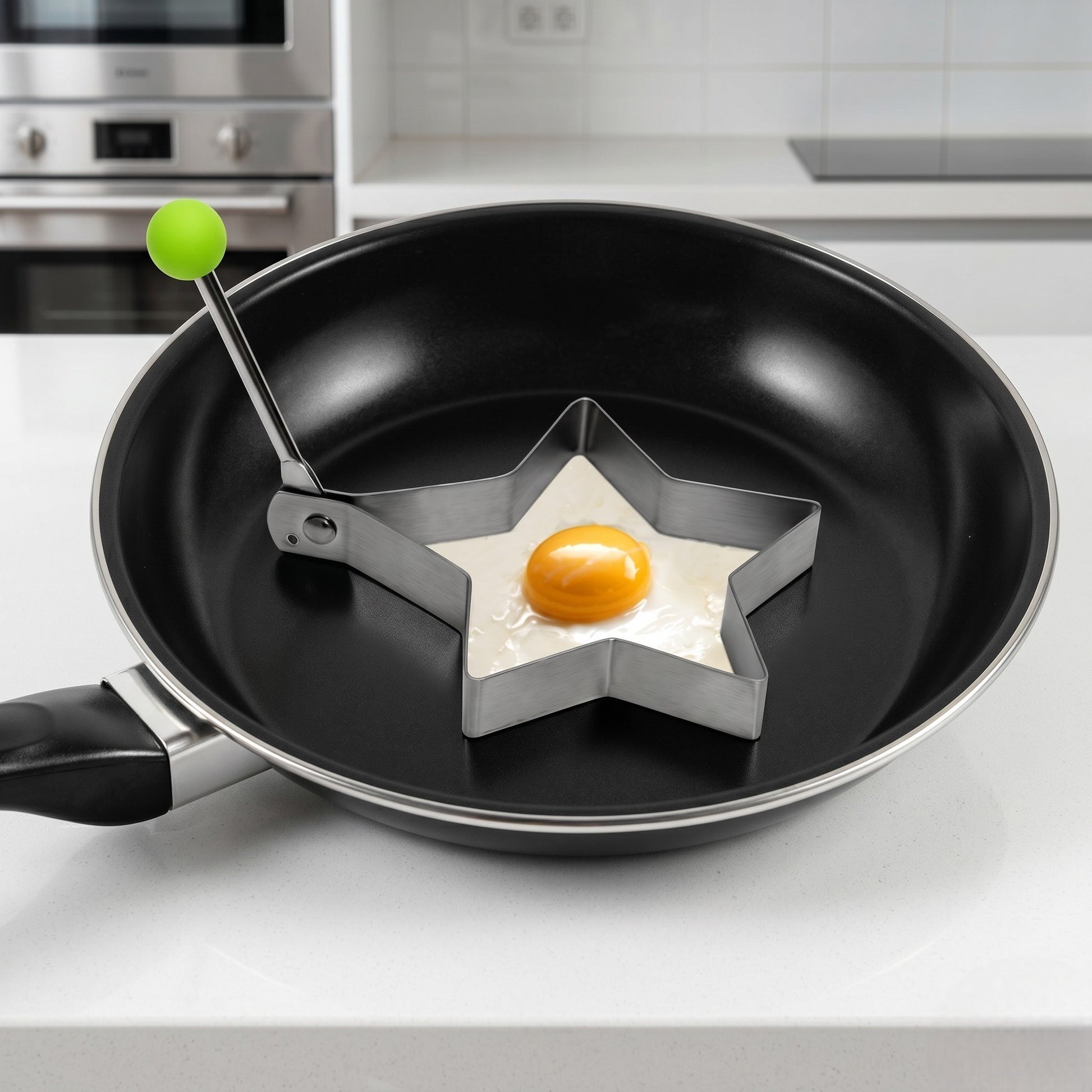 Star-shaped egg mold in a frying pan on a kitchen counter