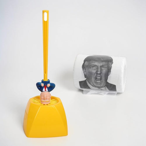Yellow toy with a character on top and a small square object with a printed face next to it on a white background