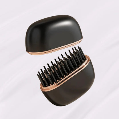 Black hairbrush with rose gold accents on a light gray background